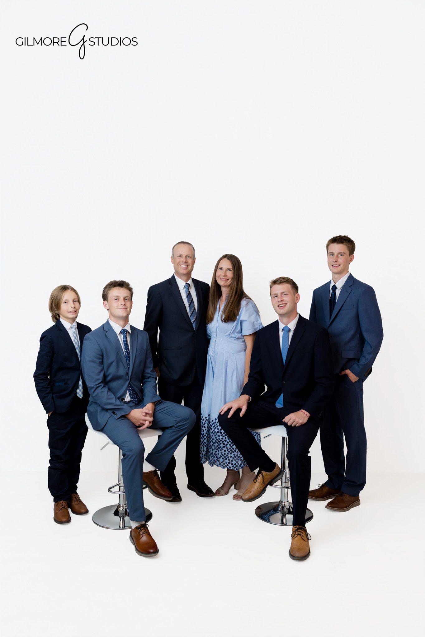 Family portrait with parents and sons dressed in suits for a timeless look
Queen Creek AZ photographer capturing a family with older kids