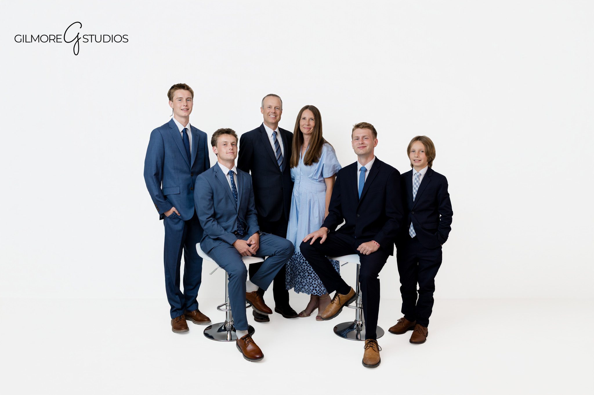 Queen Creek AZ family photography with parents and older sons in a studio portrait
Formal family portrait in Queen Creek Arizona with four boys and parents