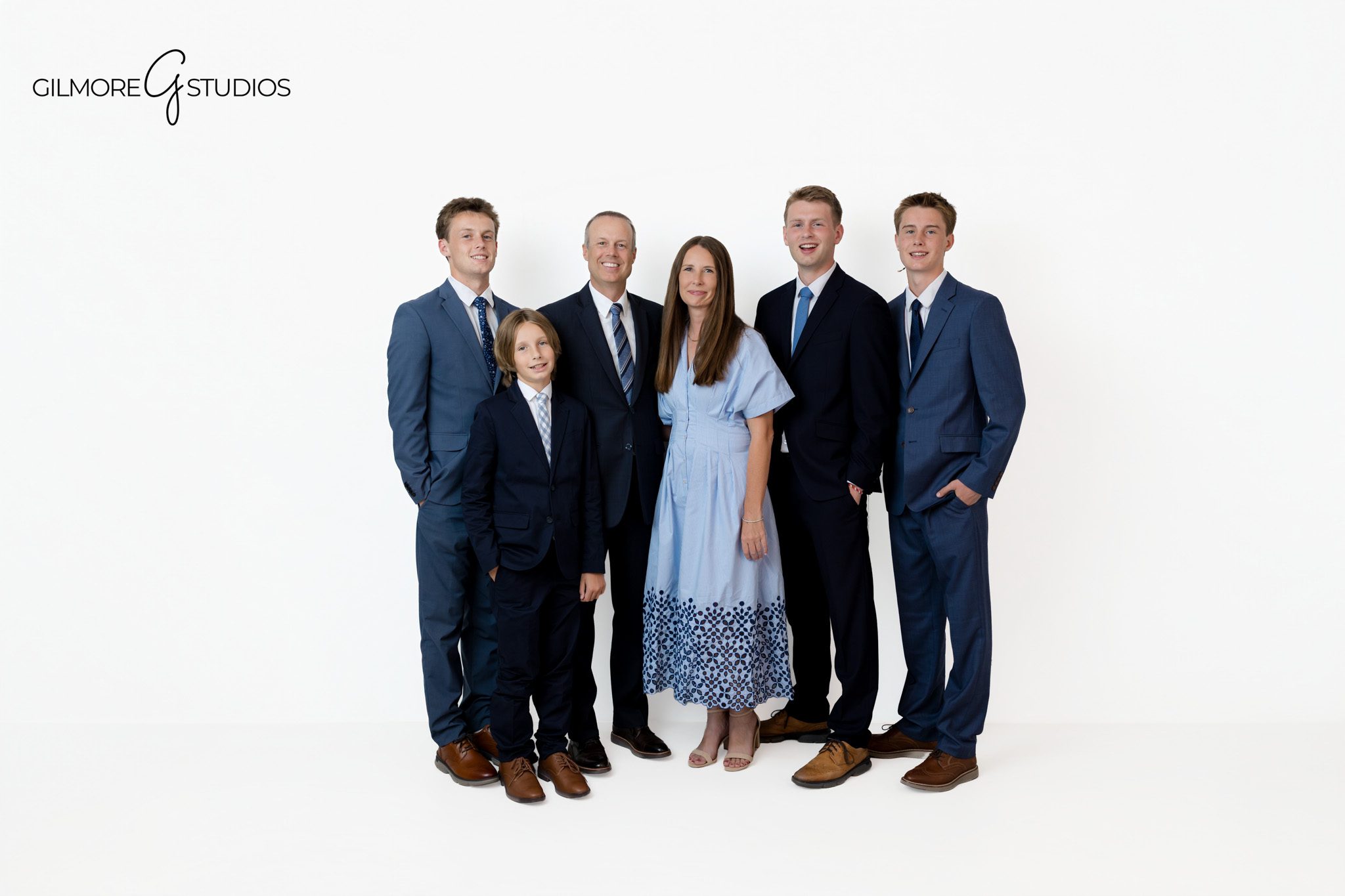 Formal family portrait with older children in navy and blue tones
Arizona studio family photography before mission or college departure