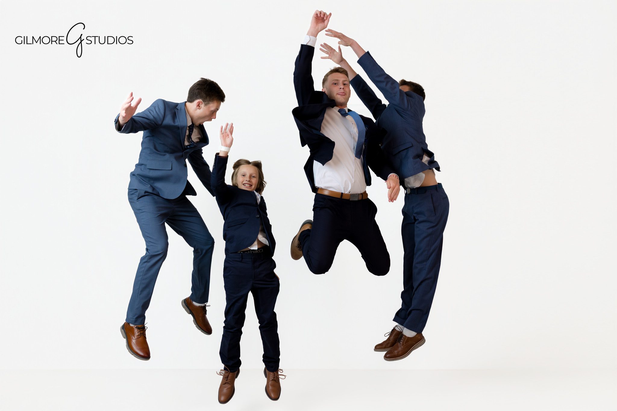 Gilmore Studios family session with parents and four sons in Queen Creek
Queen Creek family photos with classic posing and simple studio backdrop