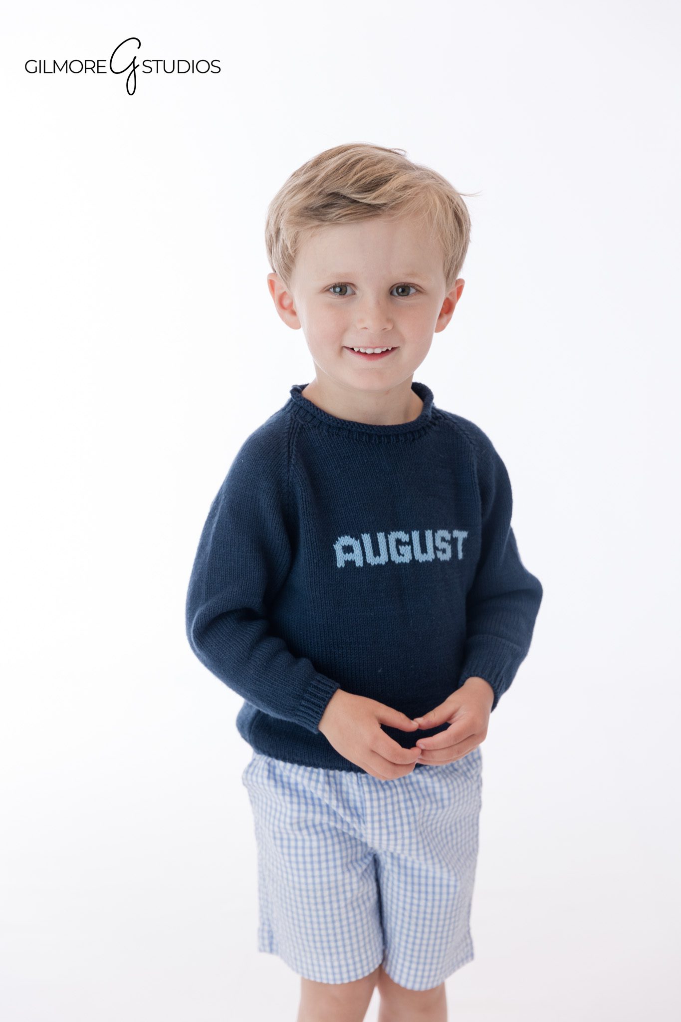 Little boy posing with hands in pockets during personality session
Personality portrait session showing playful toddler confidence