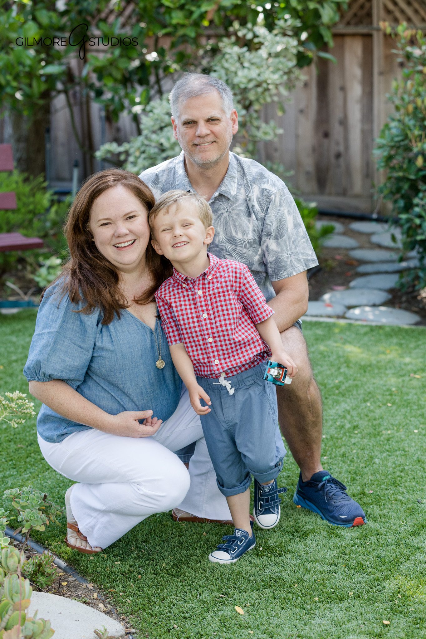 Mother and son portrait on a white studio background
Parent and child personality portrait session in Gilbert AZ