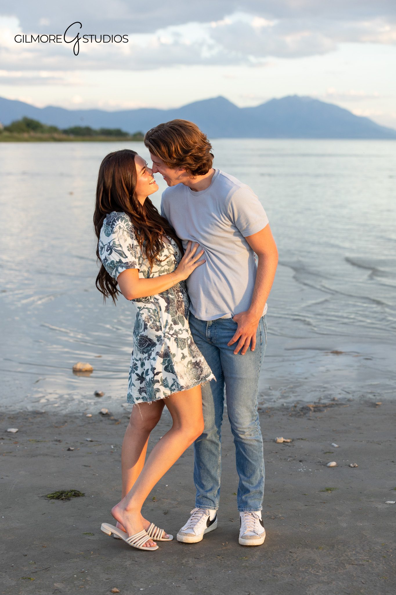 Soft pastel wardrobe for a Utah destination family session
Full family portrait with lake, mountains, and soft evening light