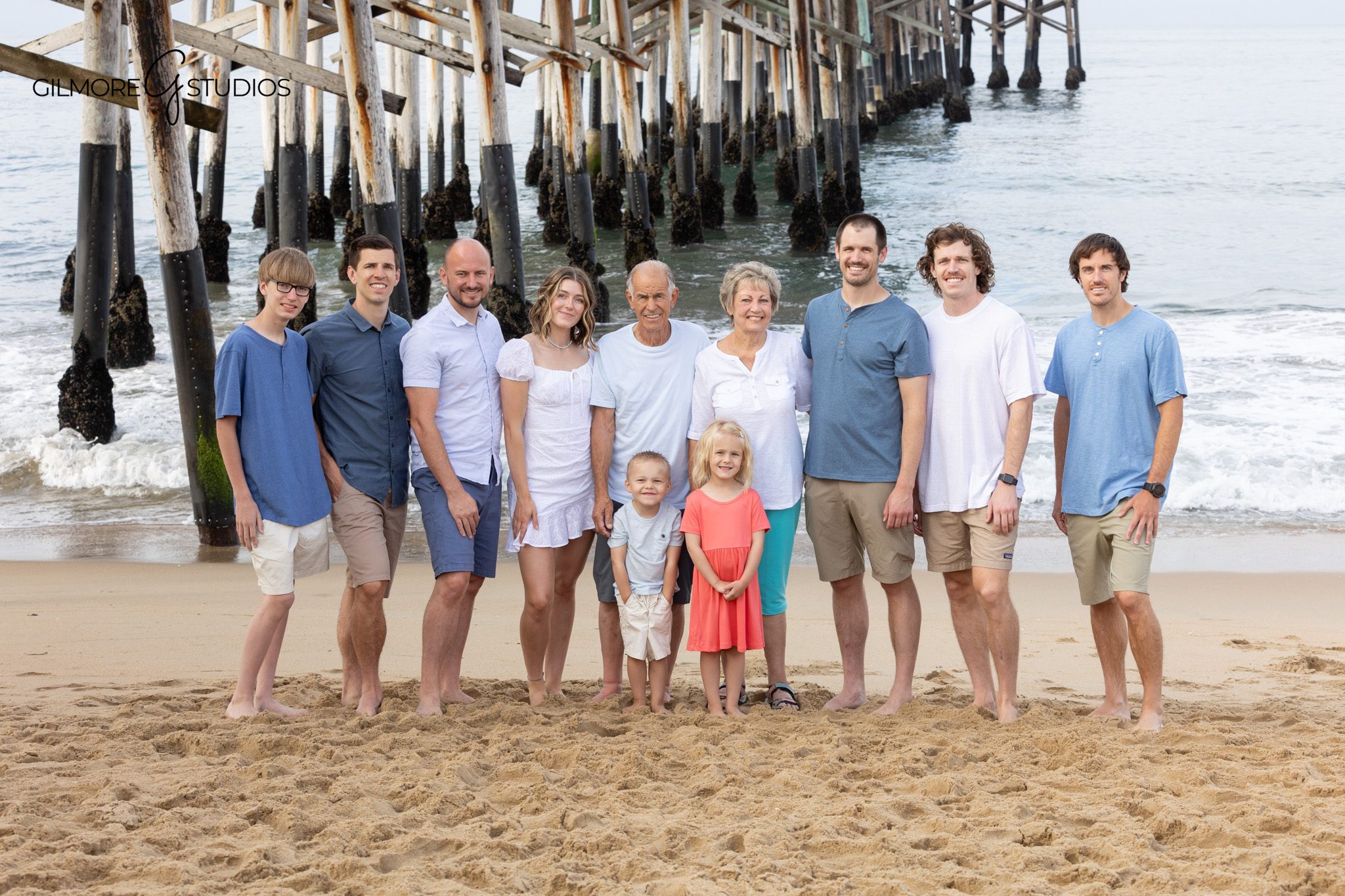Extended family standing together on the sand near Newport Beach Pier
Family reunion photography at Newport Beach Pier