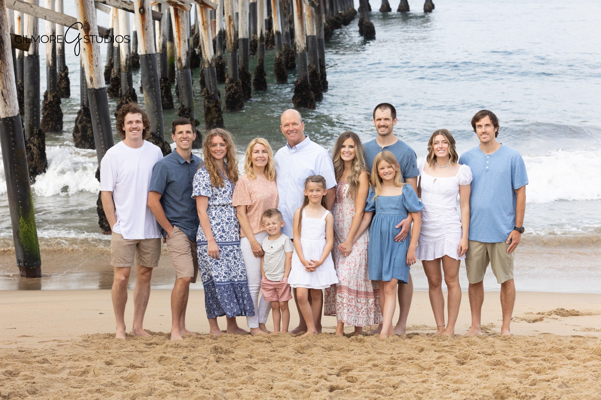 Extended family groupings photographed at the beach
Newport Beach Pier family session with adult children and grandchildren