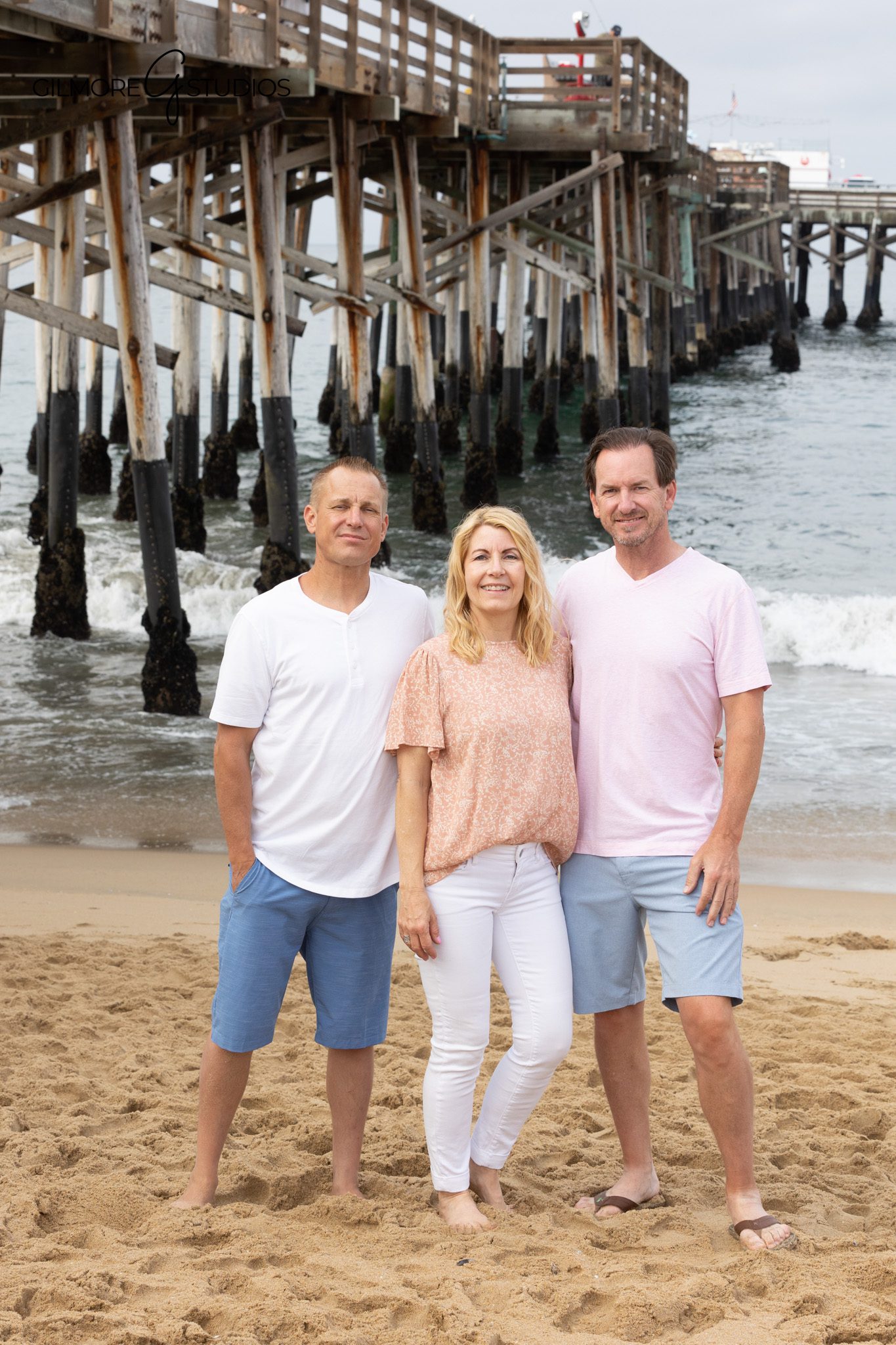 Family of six posing near the Newport Beach Pier
Beach family photos with four young children near the pier