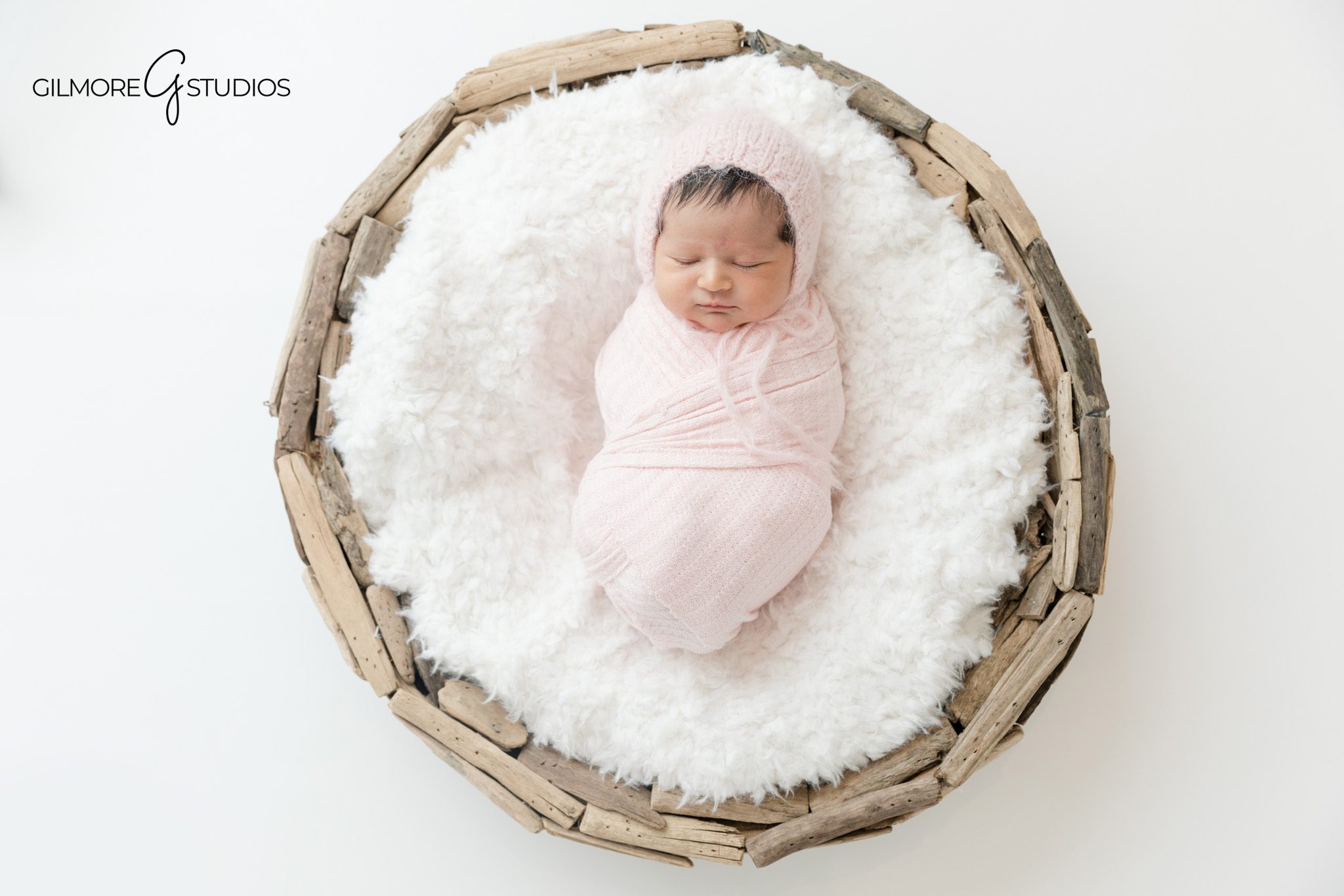 Queen Creek newborn session with feminine floral details
Sleeping newborn baby girl in soft white bonnet