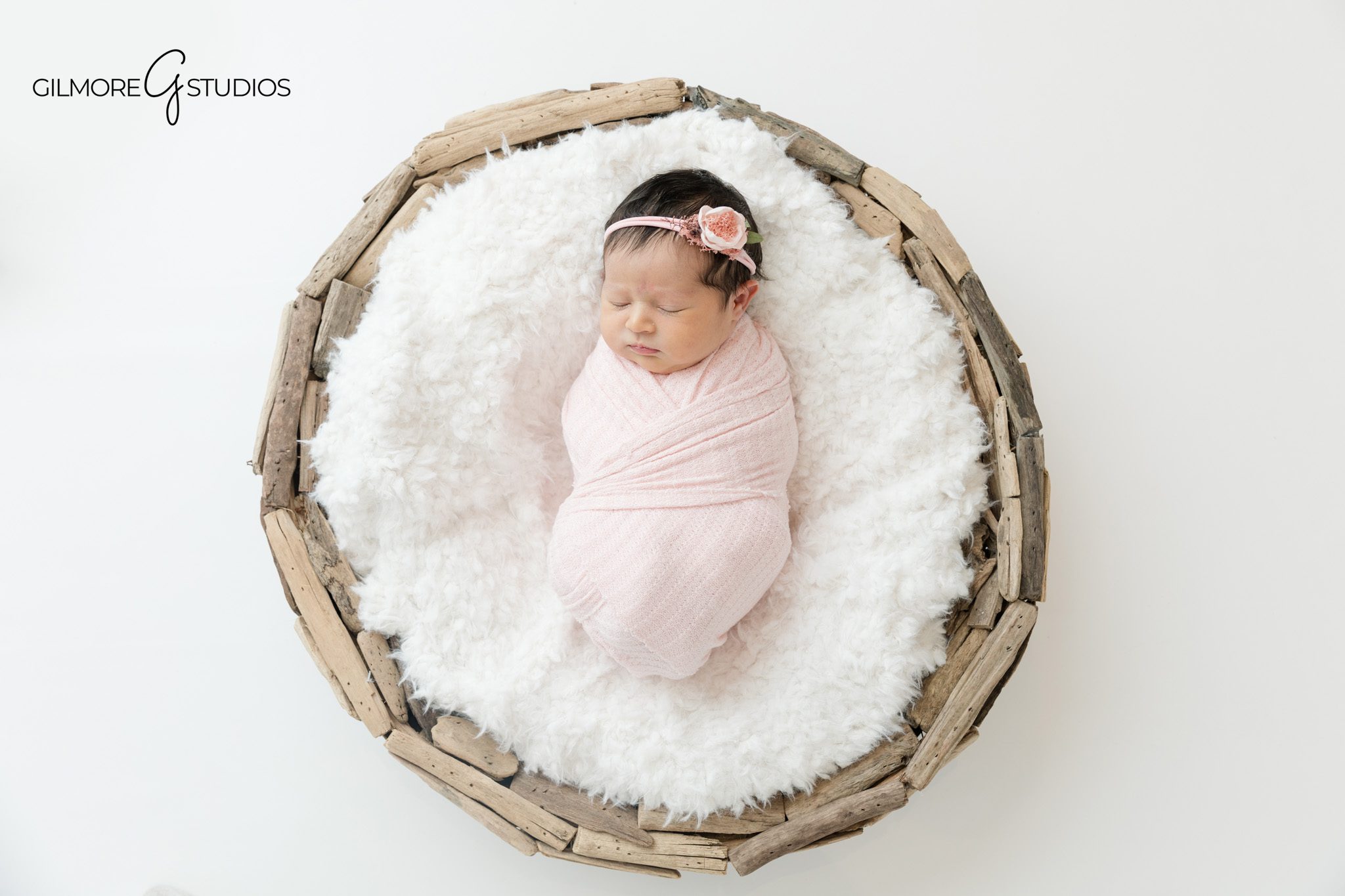 Queen Creek newborn photos with parents holding baby
Soft white newborn photography by Gilmore Studios