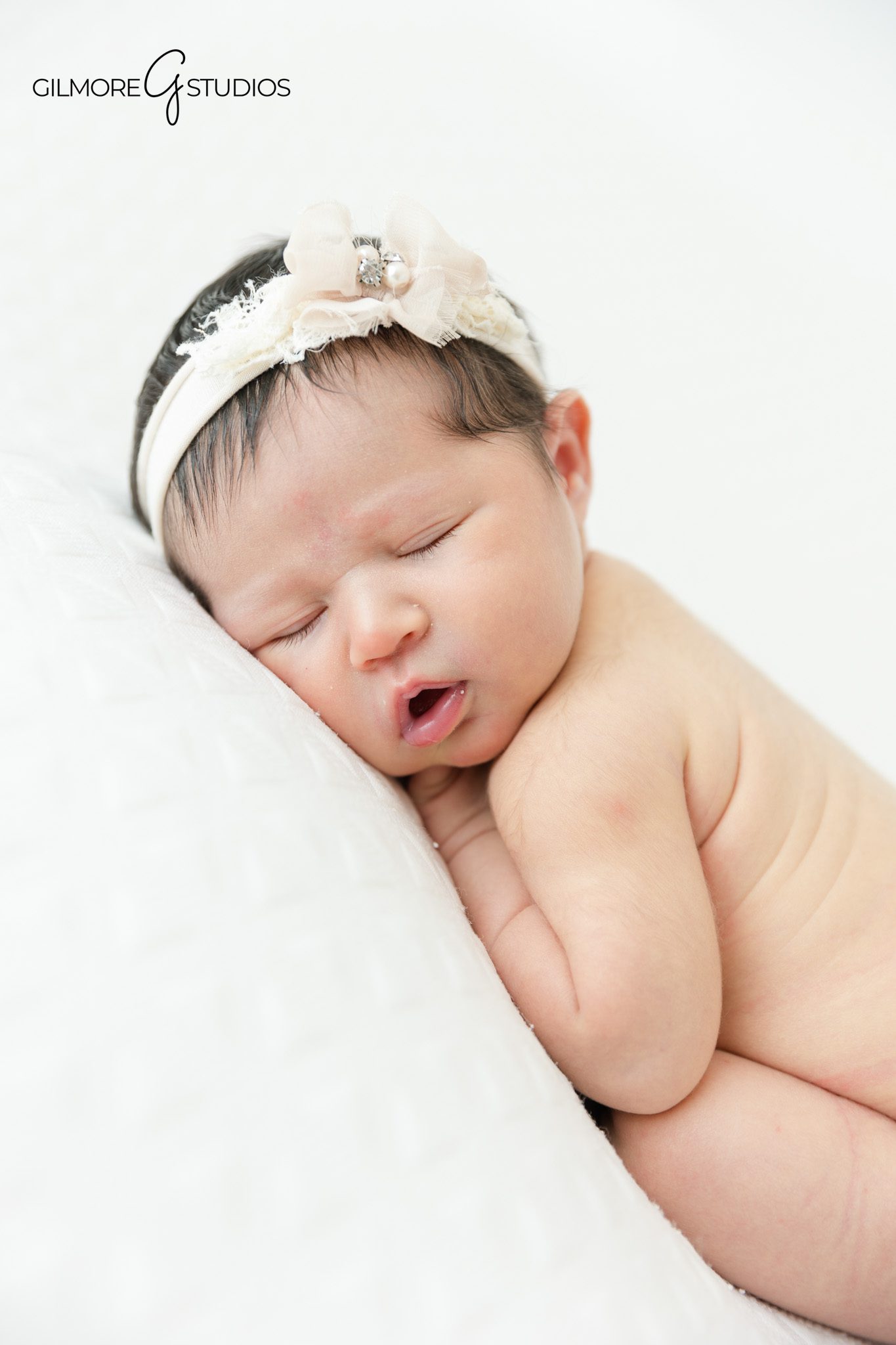 Mom and dad holding newborn baby girl in studio
Queen Creek baby photographer for newborn girl portraits