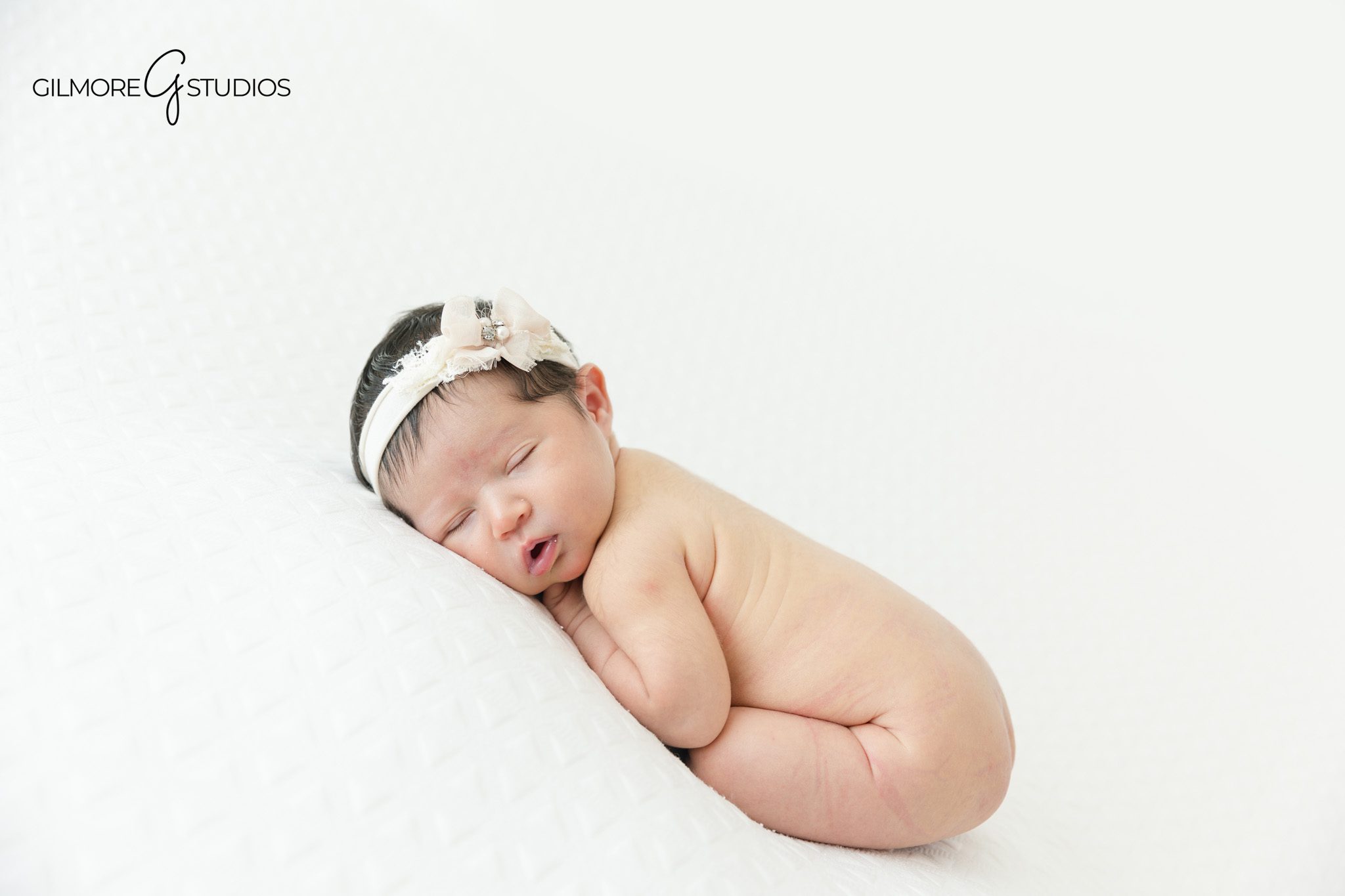 Newborn baby girl with parents on white studio backdrop
Sweet parent and baby newborn portrait in Queen Creek