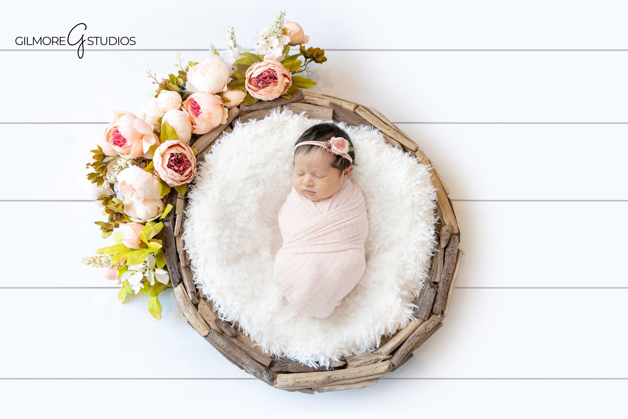 Studio newborn session with mom dad and baby girl
Baby girl newborn portrait with white bow headband