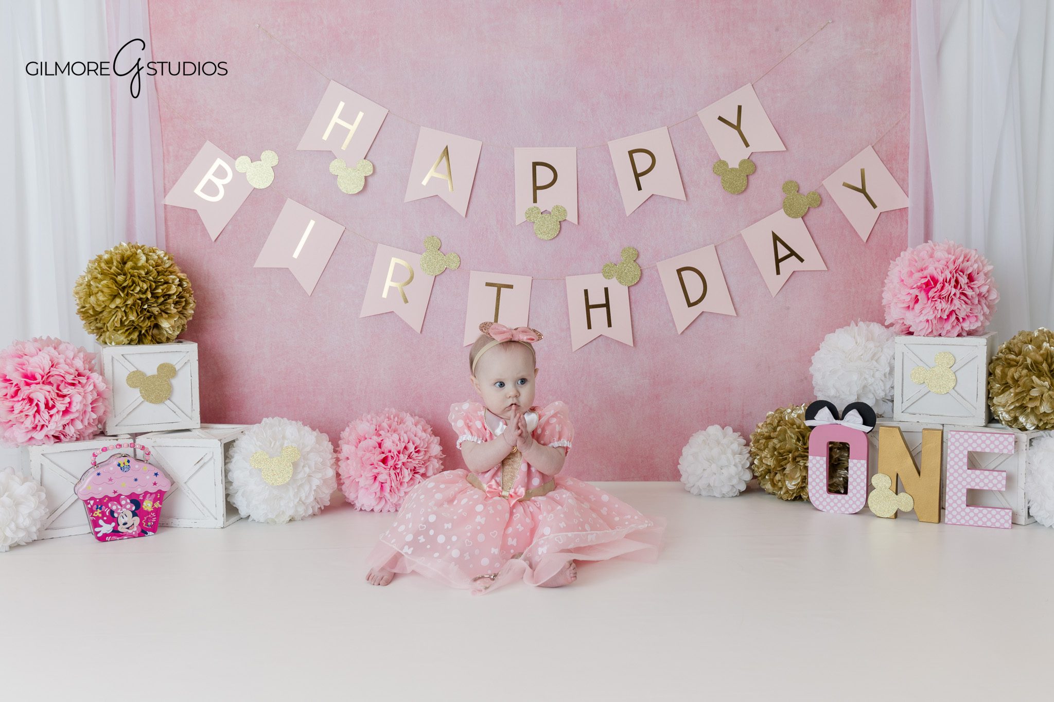 Queen Creek baby photographer capturing first birthday cake smash
Baby girl covered in frosting during pink cake smash photos