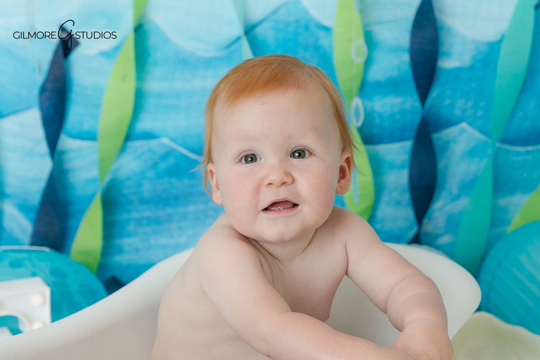 Baby boy portrait in white tub after cake smash session
Under the sea splash bath photos after first birthday cake smash