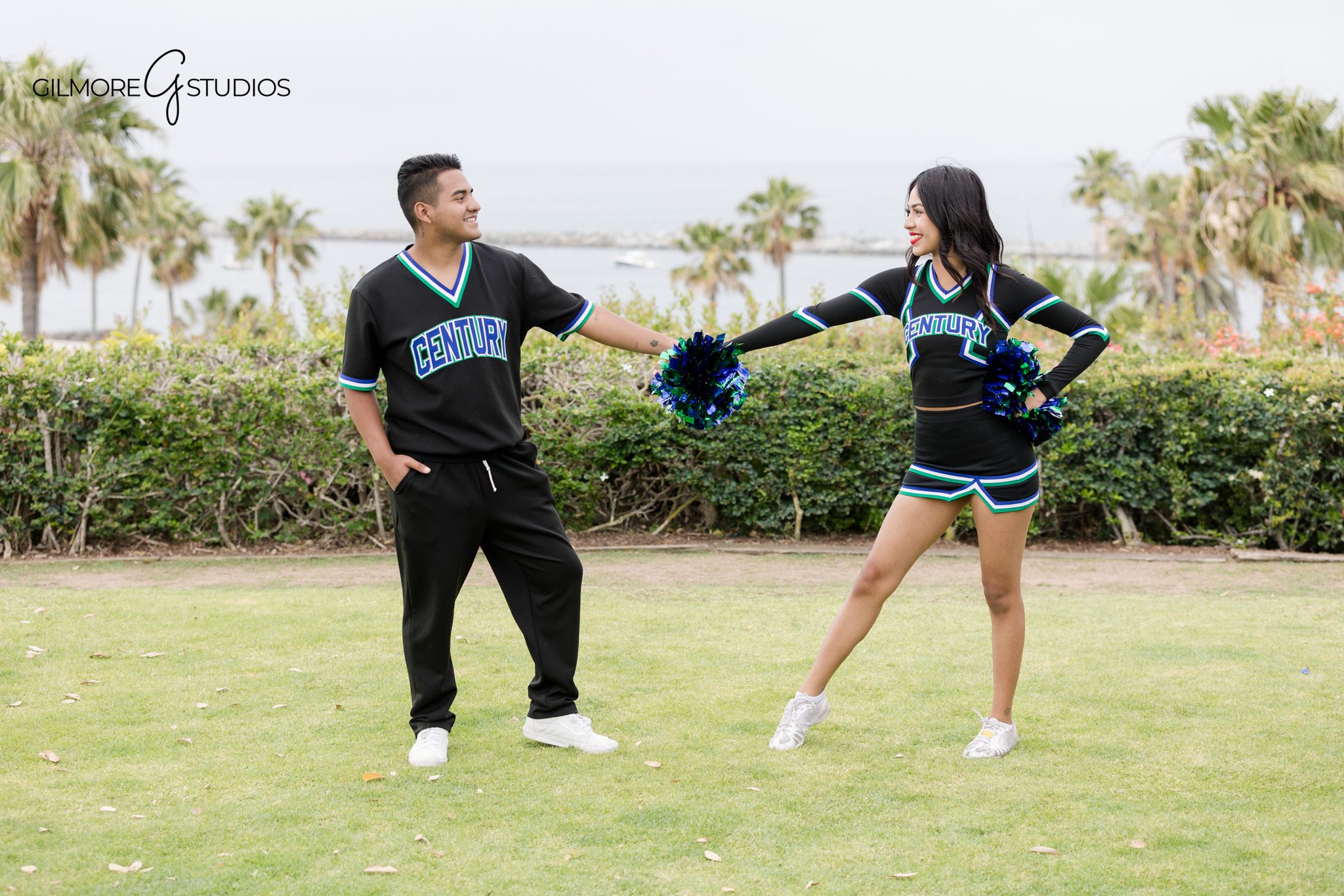 Century High School cheer team posing in black uniforms
Large cheer squad group photo in Newport Beach