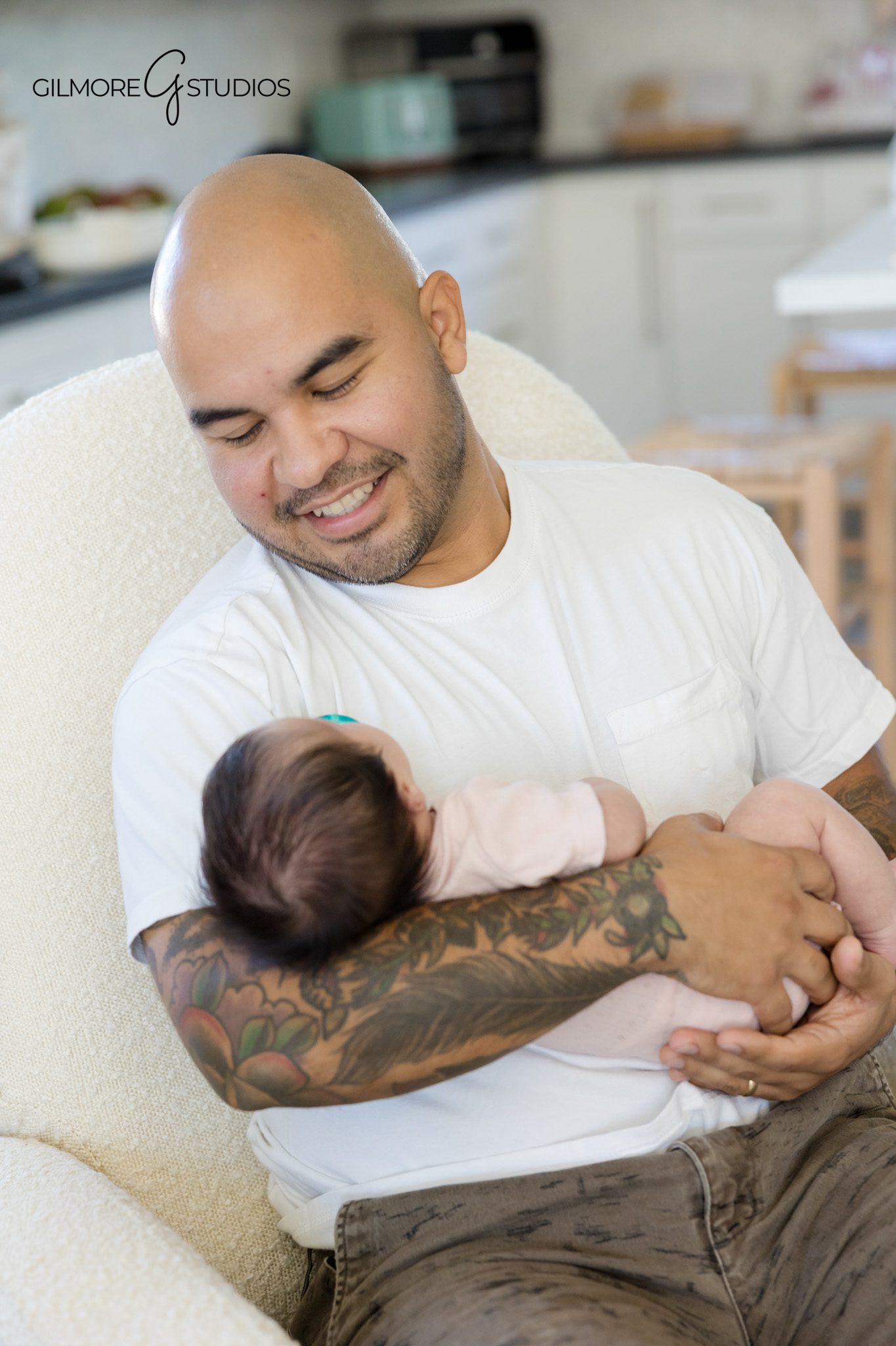 Cozy candid newborn photos at home in Queen Creek Arizona
Baby girl sleeping in dad’s arms during lifestyle newborn session