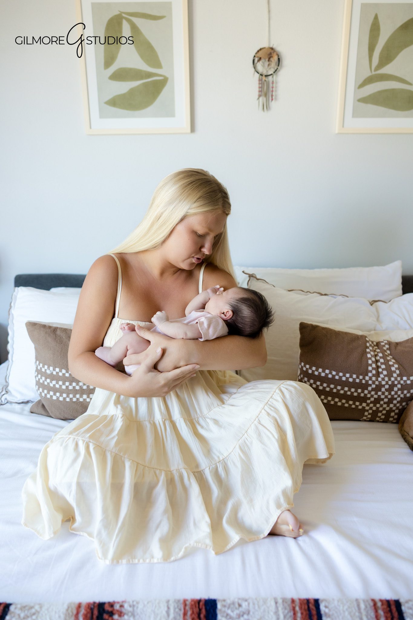 Queen Creek newborn photographer capturing natural family moments at home
Newborn baby girl resting peacefully in her father’s arms
