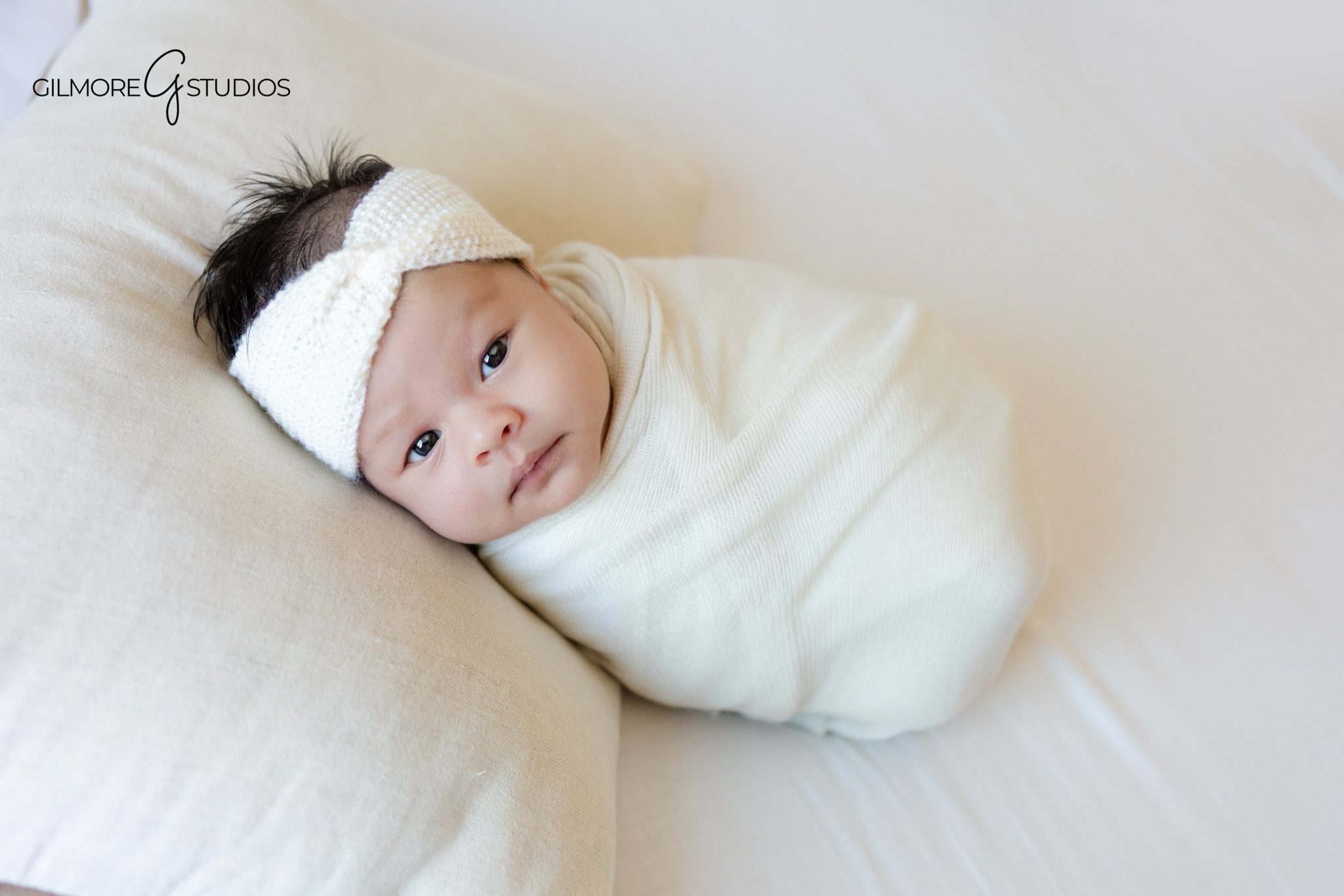 Lifestyle newborn photo with baby girl and neutral knit toy
Sweet baby girl sleeping beside stuffed animal during at home photos