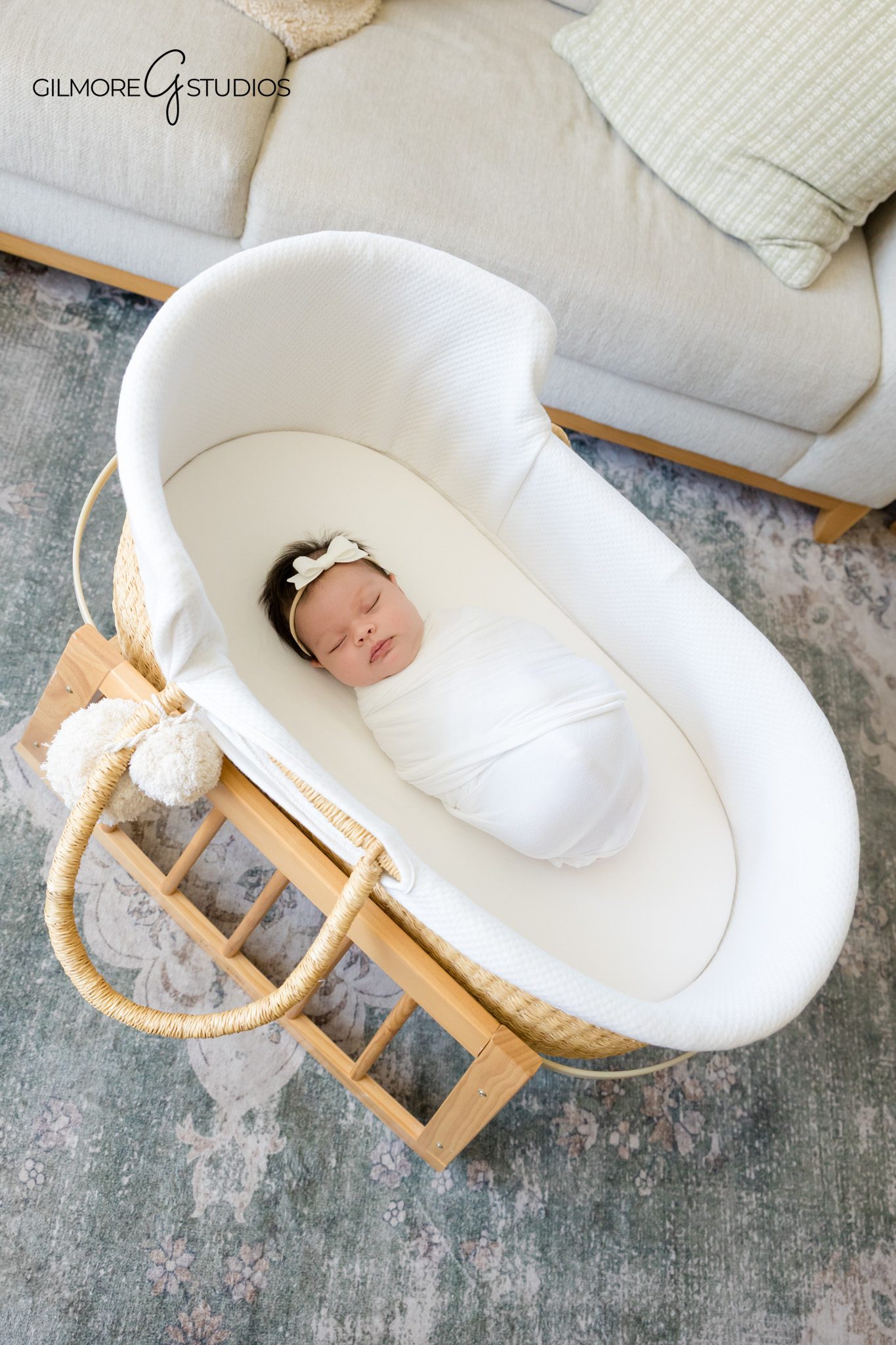 Newborn baby girl sleeping with cream bow headband
Soft neutral newborn photography in Queen Creek Arizona