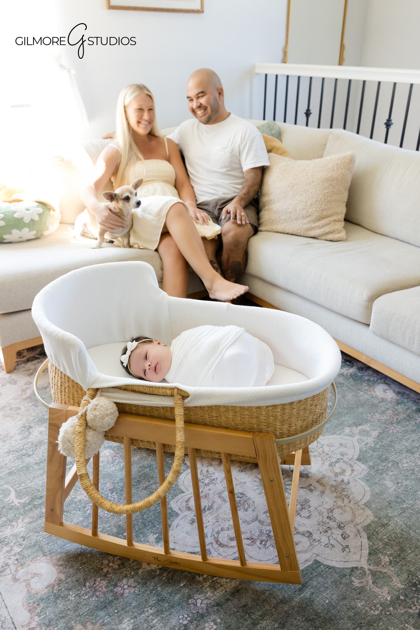 Family newborn photo with baby and dog on cozy bedroom couch
Queen Creek at home newborn photos with parents and pet