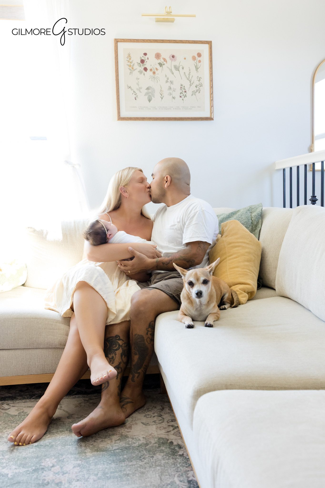 Baby girl cuddling knit lion toy during lifestyle newborn session
Newborn portrait with stuffed animal in cozy nursery chair