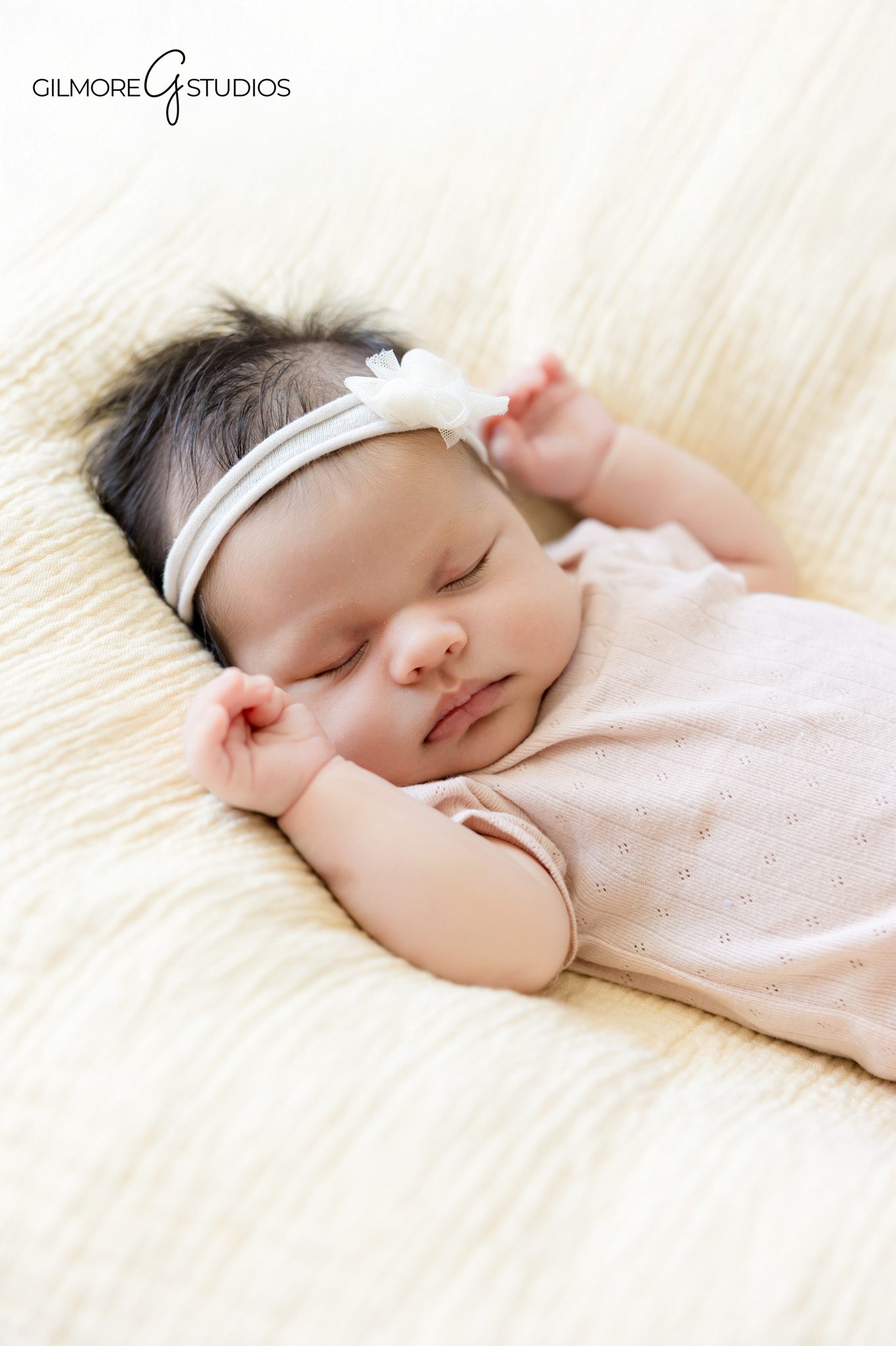 Queen Creek newborn session with baby sleeping in woven cradle
Cozy home newborn portrait with neutral nursery details