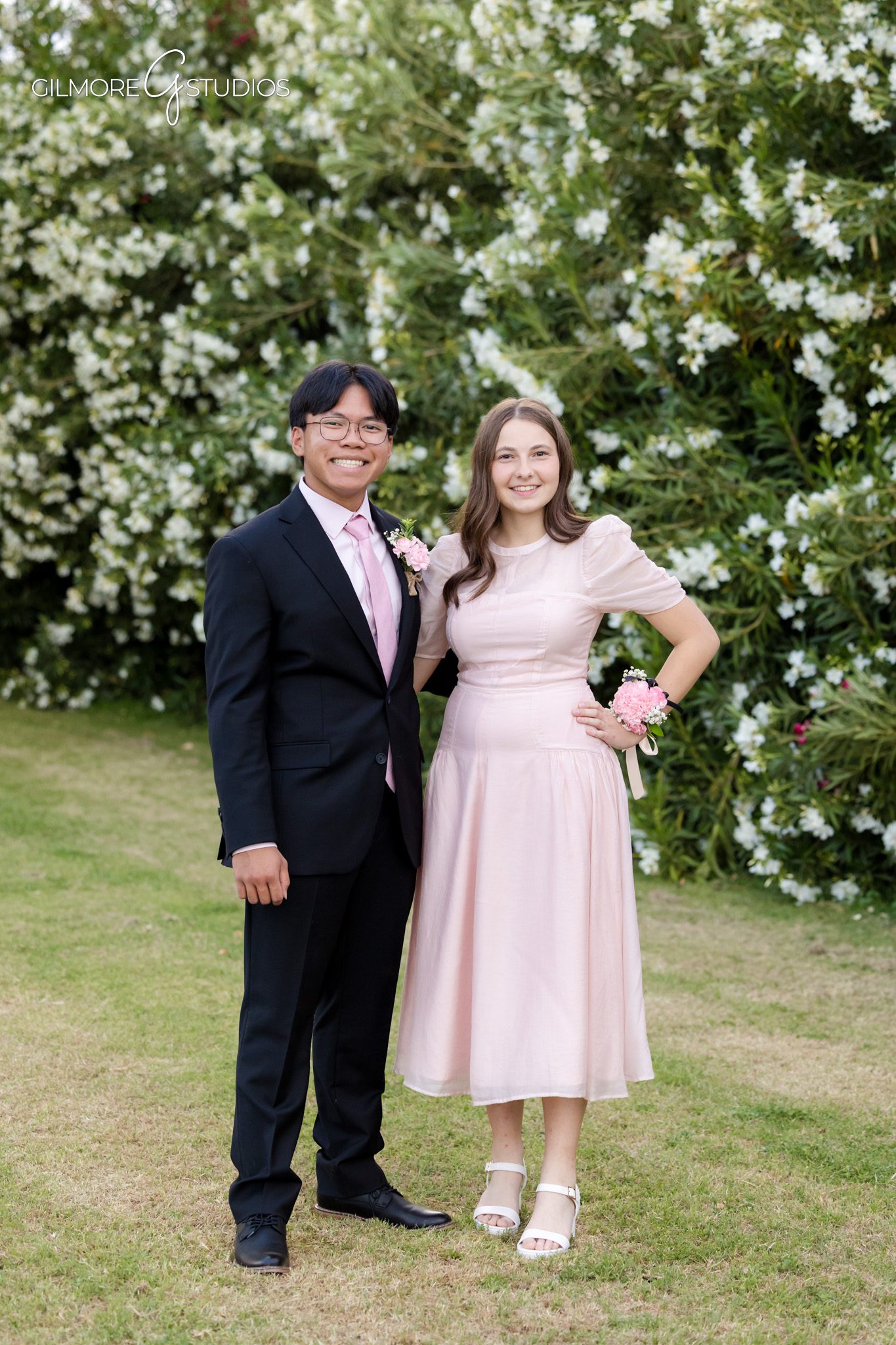 Gilbert AZ prom photos with spring flowers
Formal prom portrait of couple in colorful outfits