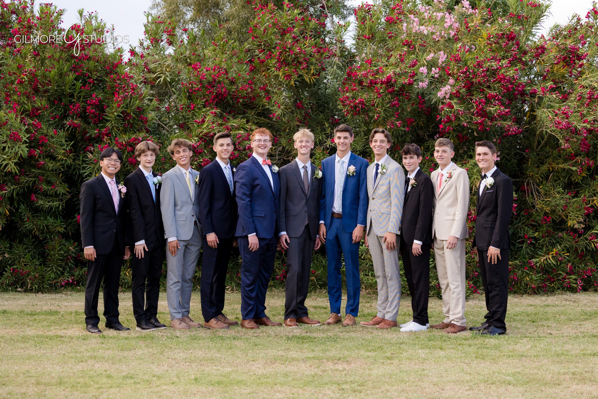 Prom couple portrait with floral dress and black suit
Gilbert AZ prom photos with white flowering bushes