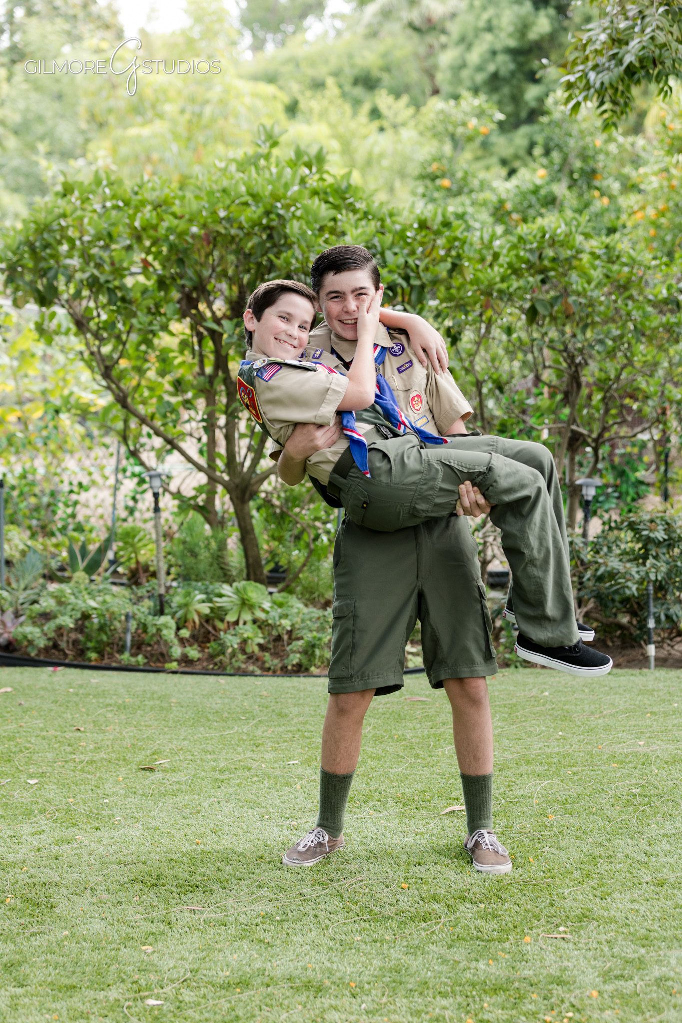 Two Scouts smiling together in formal Eagle Scout portraits
Brother Eagle Scout session in a garden location